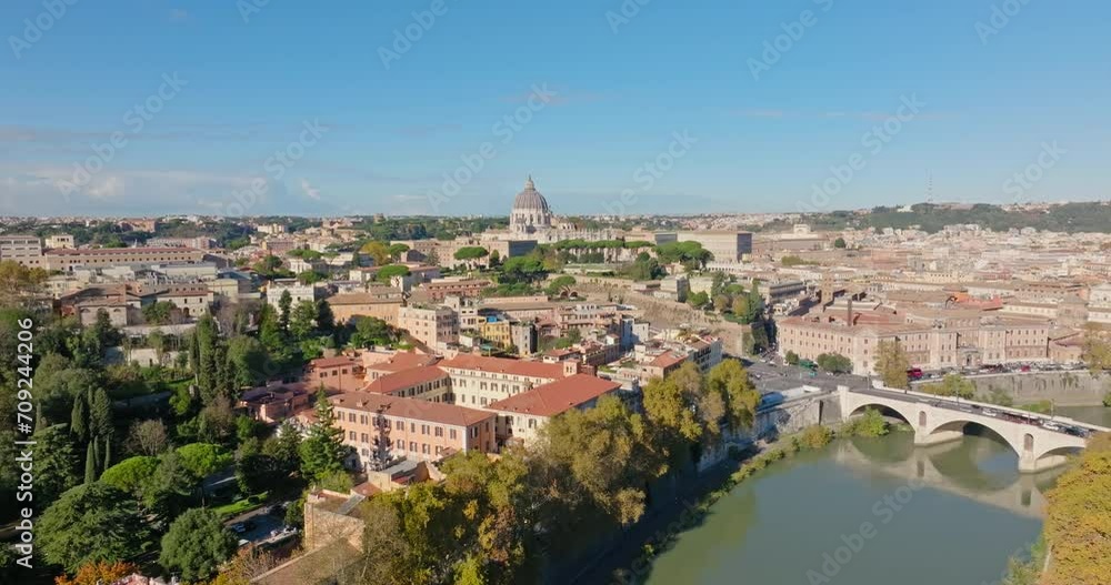 Aerial view of the urban cityscape with the Tiber river in Rome, Italy. Bridge over the river with a view of the cathedral in the architecture of the ancient city. High quality 4k footage Aerial view of the urban cityscape with the Tiber river in Rome, Italy. Bridge over the river with a view of the cathedral in the architecture of the ancient city. High quality 4k footage