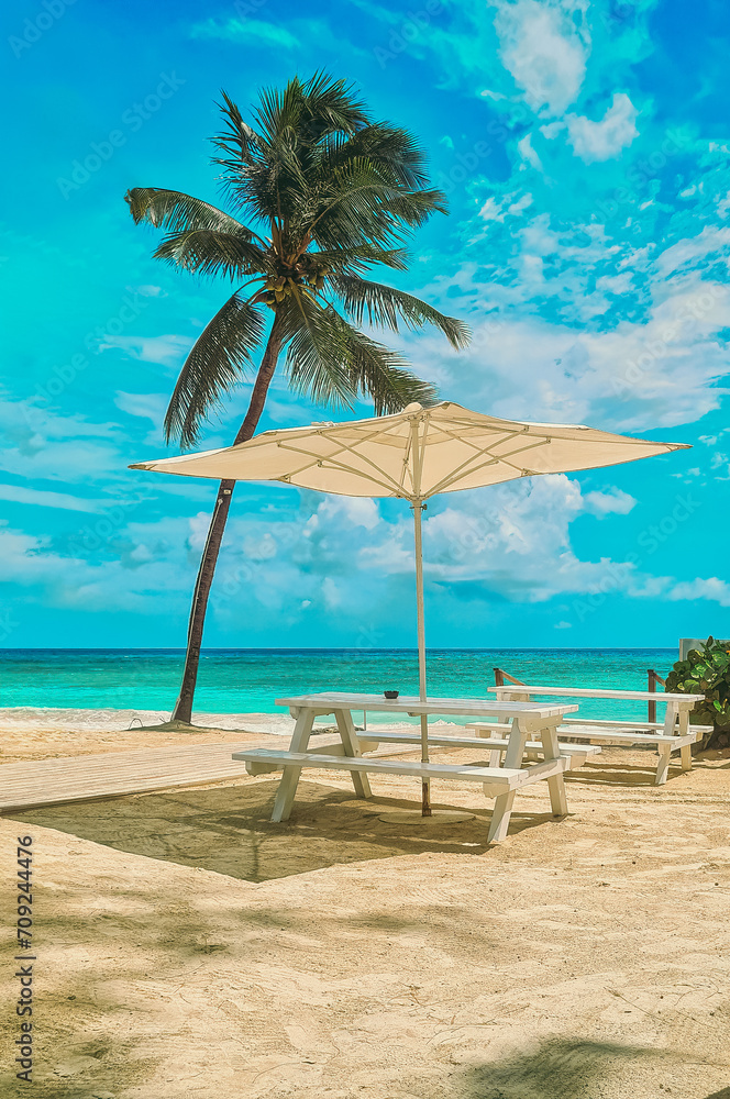 Beach chairs, umbrella on the sandy beach near the sea. Summer holiday