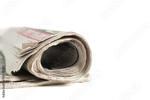 Rolled newspapers on a white