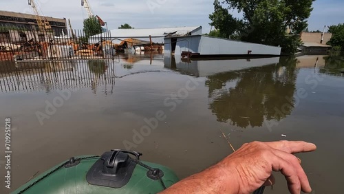 Flooding in Kherson town as a result of the explosion of a dam on the Dnipro river in city of Novaya Kakhovka. Consequences of the detonation of Kakhovka Hydroelectric Power Station. War in Ukraine. photo