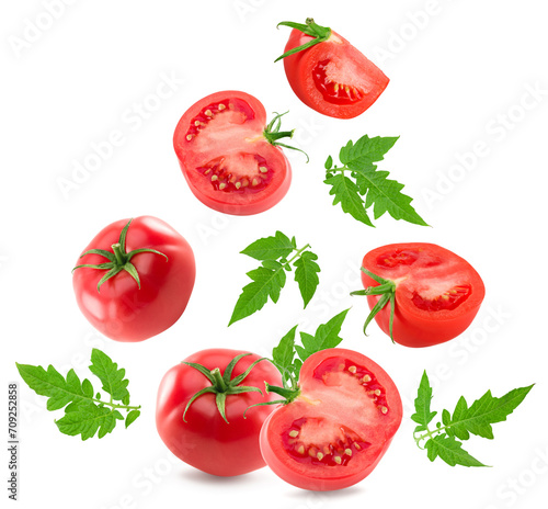 flying fresh tomatoes with green leaves isolated on white background. clipping path