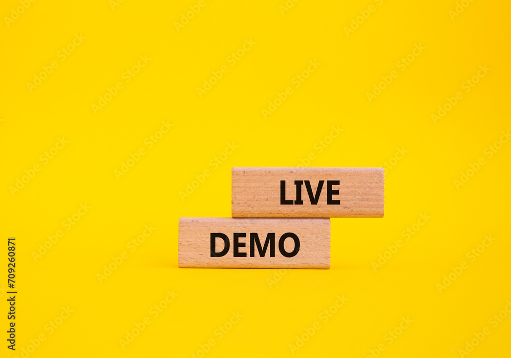 Live Demo symbol. Concept word Live Demo on wooden blocks. Beautiful yellow background. Business and Live Demo concept. Copy space - obrazy, fototapety, plakaty 