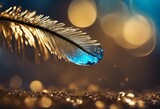Big blue dew drop of rain water on a blue bird feather and gold tinsel close-up macro with soft blur
