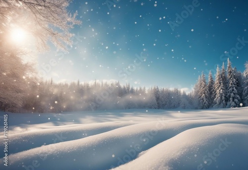Winter snow background with snowdrifts beautiful light and falling flakes of snow on blue sky drifti