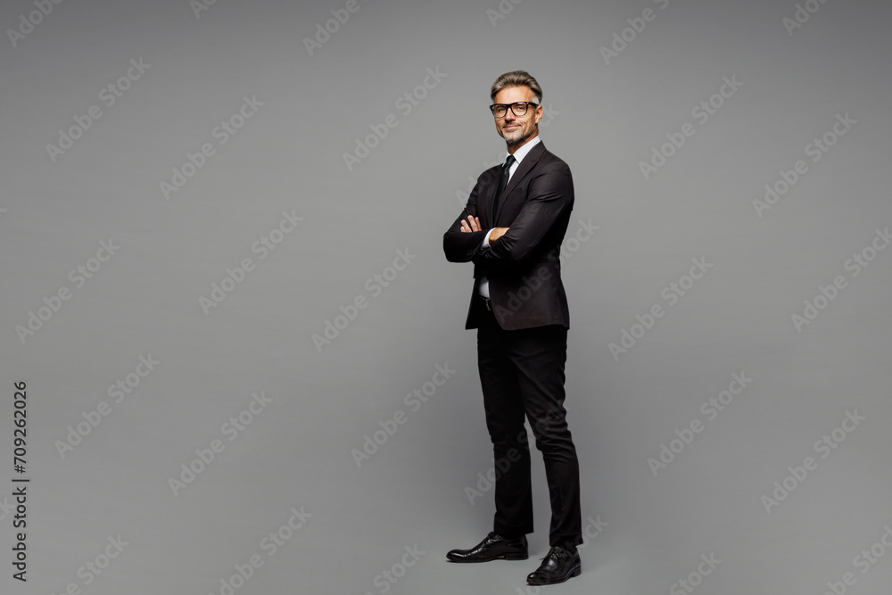Full body side view fun adult successful employee business man corporate lawyer wear classic formal black suit shirt tie work in office look camera isolated on plain grey background studio portrait. - obrazy, fototapety, plakaty 