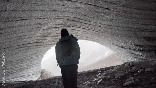 Rounded tunnel ice cave view from the inside. Cueva de Jimbo, Ushuaia, Tierra del Fuego photo