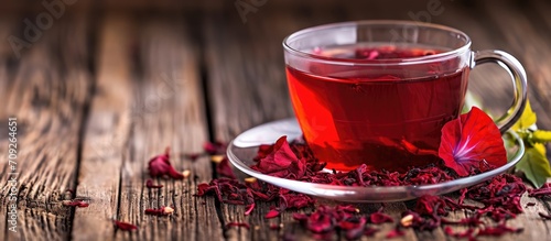 Red Tea, made from hibiscus and lemongrass, is a caffeine-free herbal tea that aids in weight loss due to its distinctive color. photo