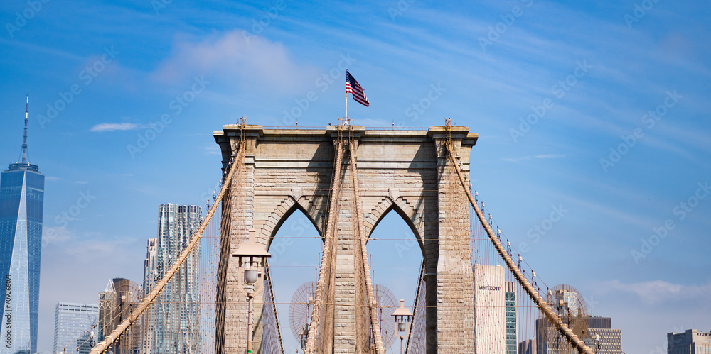 Fototapeta premium Brooklyn bridge in New York. Architecture of historic bridge in Brooklyn. Brooklyn bridge of New York city. New York bridge connecting Manhattan and Brooklyn. American architecture landmark