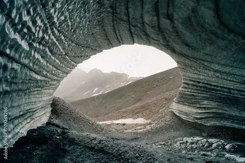 Rounded tunnel ice cave view from the inside. Cueva de Jimbo, Ushuaia, Tierra del Fuego photo