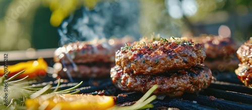 Grilled beef burgers outdoors