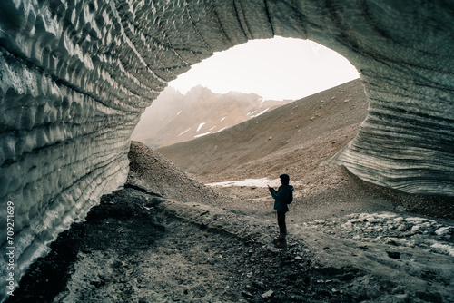 Rounded tunnel ice cave view from the inside. Cueva de Jimbo, Ushuaia, Tierra del Fuego photo