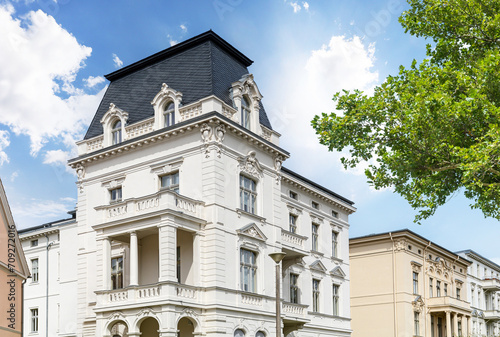 Canvas Print Facade of a classical villa in the city, old building with new facade after reno
