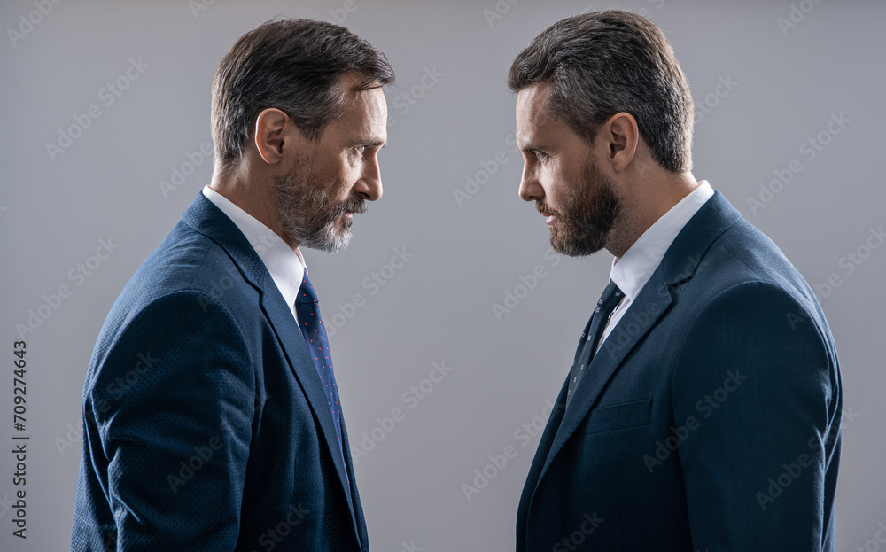 businessmen having rivalry in the business competition and intense negotiation isolated on grey businessmen having rivalry in the business competition and intense negotiation isolated on grey