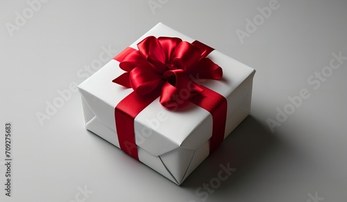 Gift Box on a White Background with Red Ribbon