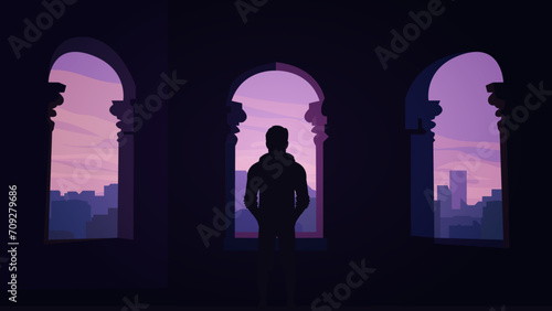 silhouette of a person looking at the town