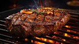 Beef steak on the grill with flames and smoke, closeup