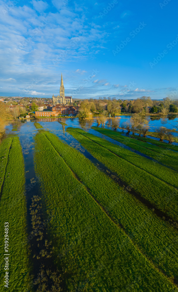 Wide Angle Aerial shot of Salisbury Cathedral and flooded Meadows