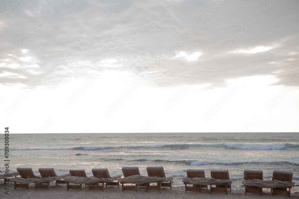 Beach chairs facing ocean, Kona, Hawaii