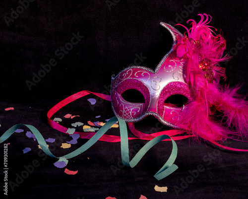 venetian carnival pink mask with confetti