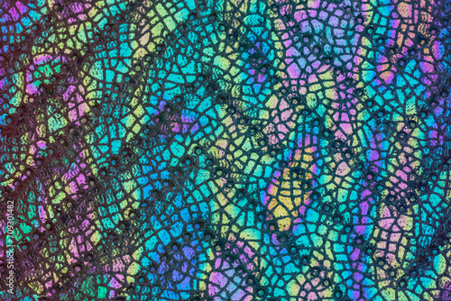 Holographic fabric with a snake structure Abstract colorful background