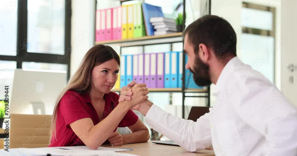 Office workers test strength with arm-wrestling challenge Office workers test strength with arm-wrestling challenge