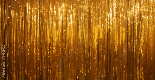 Golden sparkling tinsel curtain, wide party background. Foil fringe disco backdrop