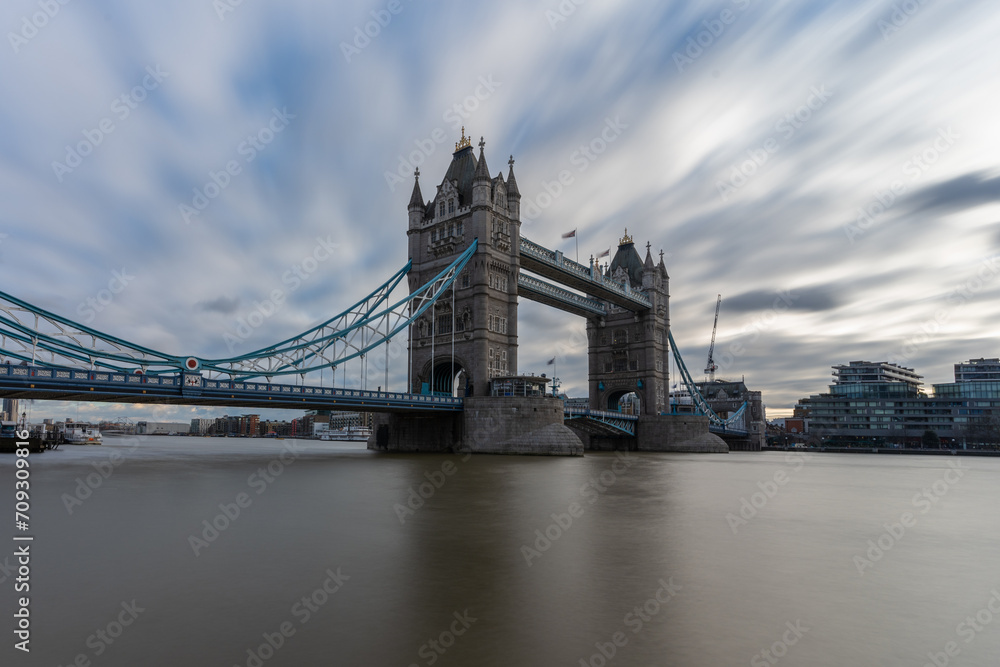 View of tower bridge, London over river Thames in long exposure