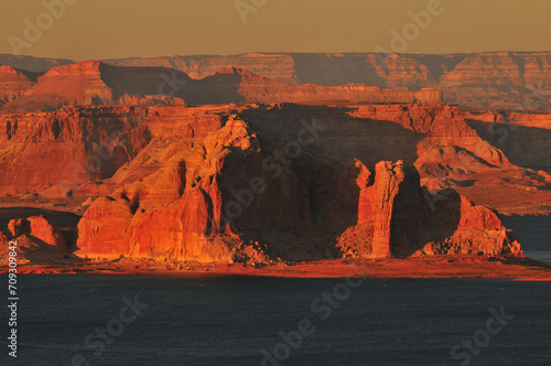 Sunset view of the buttes and cliffs around Lake Powell, over the state border in Utah, from the Wahweap Overlook, near Page, Glen Canyon National Recreation Area, Arizona, Southwest USA. photo