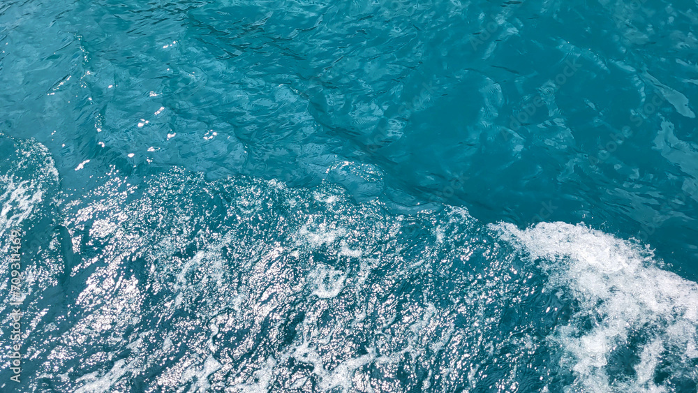 Obraz premium Background blue sea waves on a summer day