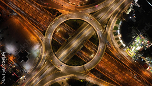 Aerial drone slow shutter night photo of illuminated urban elevated toll ring road junction and interchange overpass passing through Kifisias Avenue, Attica, Greece