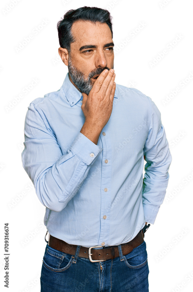 Middle aged man with beard wearing business shirt bored yawning tired covering mouth with hand. restless and sleepiness. Middle aged man with beard wearing business shirt bored yawning tired covering mouth with hand. restless and sleepiness.