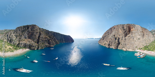 Panoramic view of the Butterfly Valley (Kelebekler Vadisi). Turquoise bay with a beach surrounded by mountains. Fethiye/Oludeniz, Mugla Province, Turkey. Aerial seamless spherical 360 degree panorama