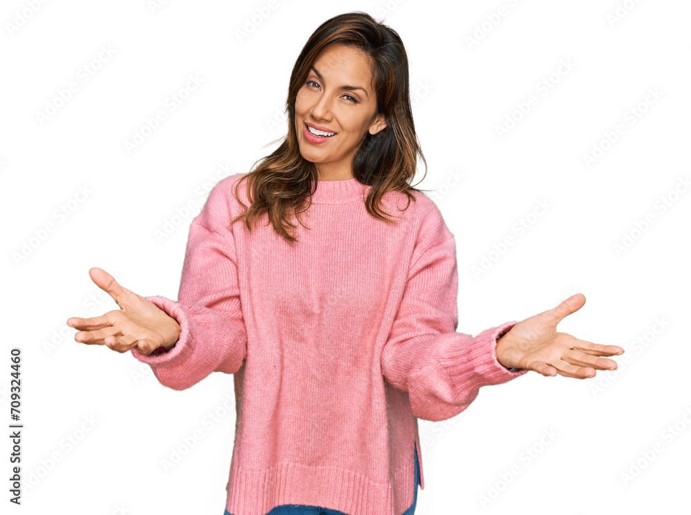 Young hispanic woman wearing casual clothes smiling cheerful offering hands giving assistance and acceptance. Young hispanic woman wearing casual clothes smiling cheerful offering hands giving assistance and acceptance.