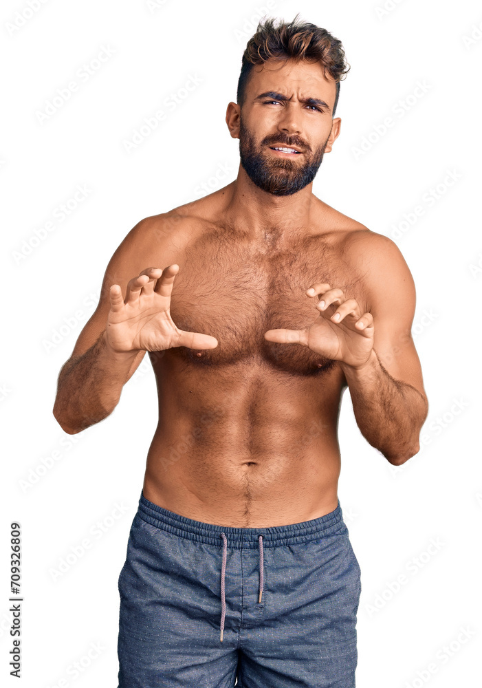 Young hispanic man wearing swimwear shirtless disgusted expression, displeased and fearful doing disgust face because aversion reaction. with hands raised Young hispanic man wearing swimwear shirtless disgusted expression, displeased and fearful doing disgust face because aversion reaction. with hands raised