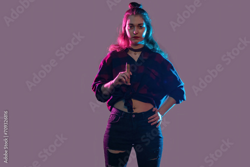 Woman vaper. Girl smokes e-...