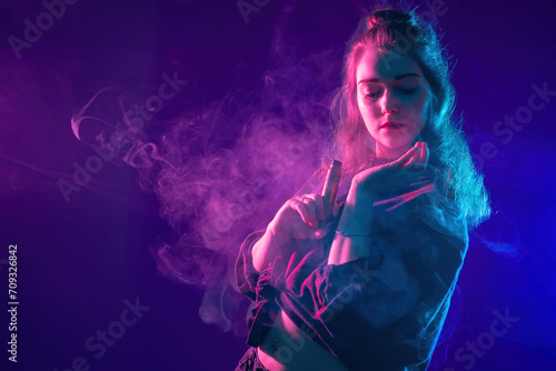 Woman is vaping. Vape pen i...