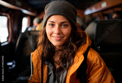 Young woman in beanie and jacket sitting in train carriage Generative AI image