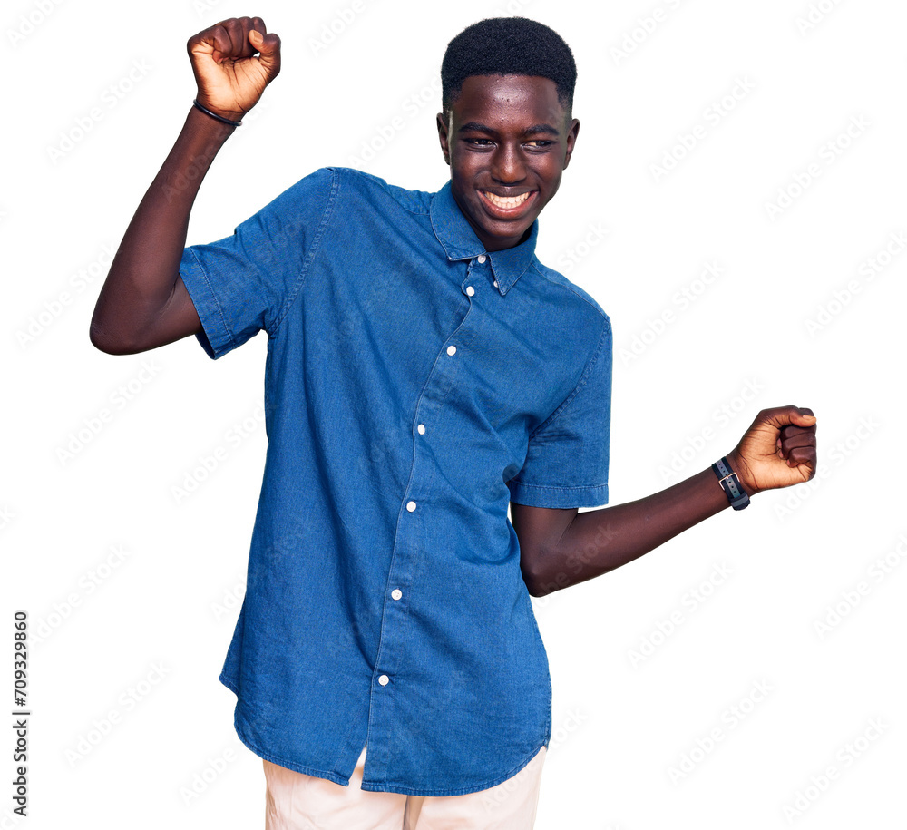 Young african american man wearing casual clothes dancing happy and cheerful, smiling moving casual and confident listening to music Young african american man wearing casual clothes dancing happy and cheerful, smiling moving casual and confident listening to music