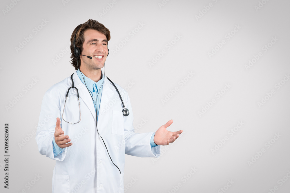 Happy man doctor with headset speaking and gesturing. Happy man doctor with headset speaking and gesturing.
