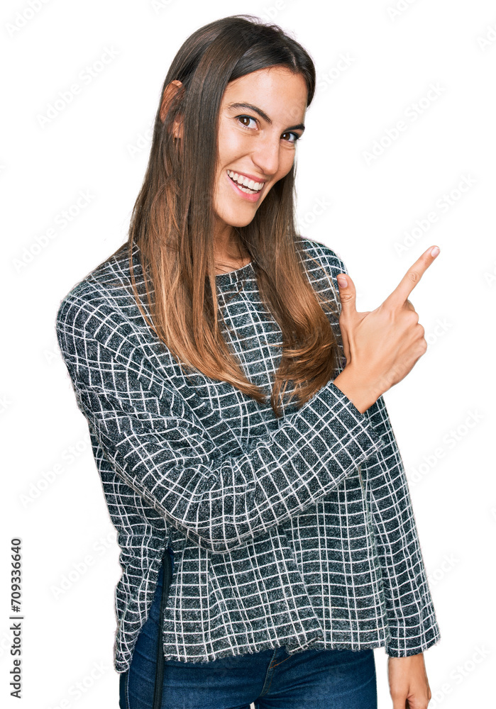 Young beautiful woman wearing casual clothes cheerful with a smile of face pointing with hand and finger up to the side with happy and natural expression on face Young beautiful woman wearing casual clothes cheerful with a smile of face pointing with hand and finger up to the side with happy and natural expression on face