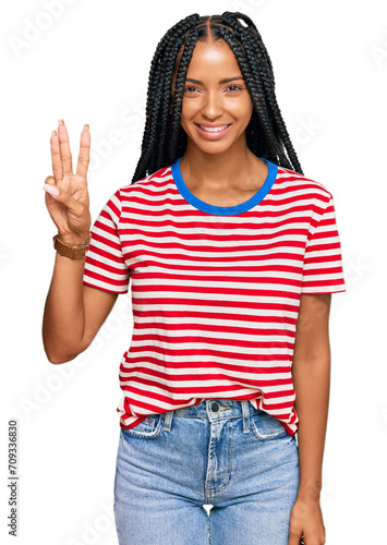 Beautiful hispanic woman wearing casual clothes showing and pointing up with fingers number three while smiling confident and happy.
