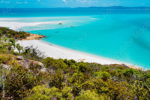 Boats transporting tourists to Whitehaven Beach is on Whitsunday Island. . The beach is known for its crystal white silica sands and turquoise colored waters. Autralia, Dec 2019 © Wagner