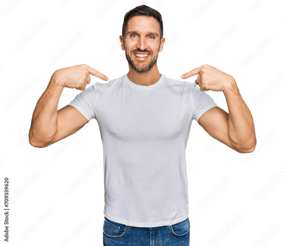 Handsome man with beard wearing casual white t shirt looking confident with smile on face, pointing oneself with fingers proud and happy. Handsome man with beard wearing casual white t shirt looking confident with smile on face, pointing oneself with fingers proud and happy.