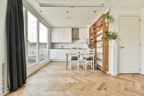 Modern kitchen and dining area with natural light
