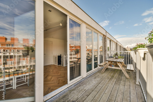 Modern Balcony with Glass Doors and Urban View photo