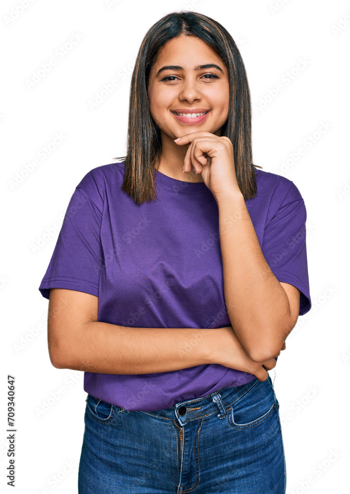 Young hispanic girl wearing casual purple t shirt looking confident at the camera with smile with crossed arms and hand raised on chin. thinking positive. Young hispanic girl wearing casual purple t shirt looking confident at the camera with smile with crossed arms and hand raised on chin. thinking positive.
