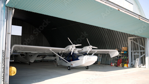 Commercial aircraft in a hangar. Skydiving concept. Airplane in hangar.