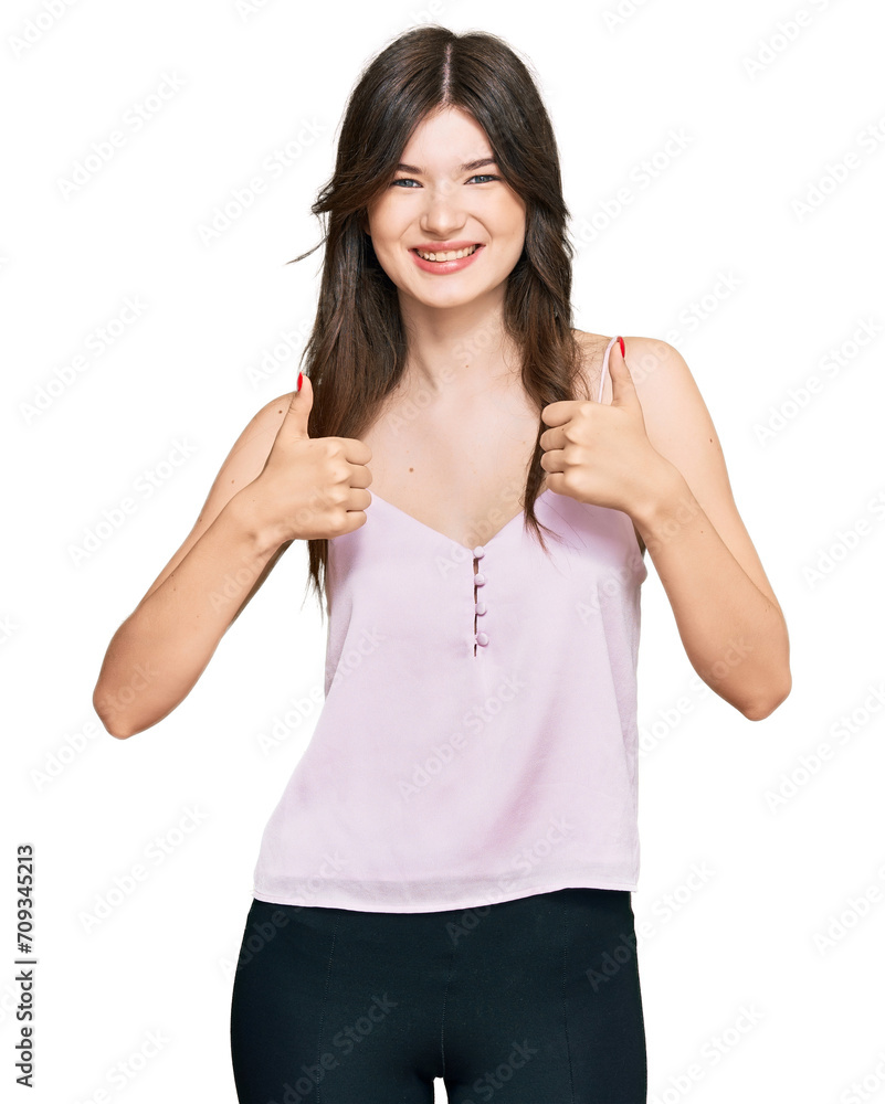 Young beautiful caucasian girl wearing casual clothes success sign doing positive gesture with hand, thumbs up smiling and happy. cheerful expression and winner gesture. Young beautiful caucasian girl wearing casual clothes success sign doing positive gesture with hand, thumbs up smiling and happy. cheerful expression and winner gesture.