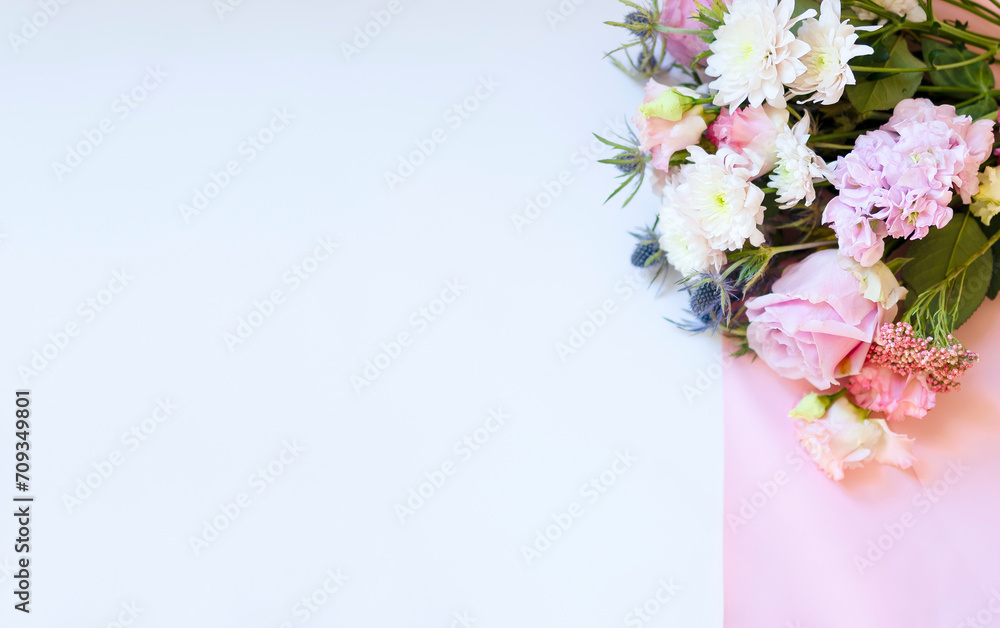 Bright floral bouquet on light background with space for copy, greeting card. Beautiful background with flowers white, pink, blue, banner for text and congratulations, mother's day, wedding