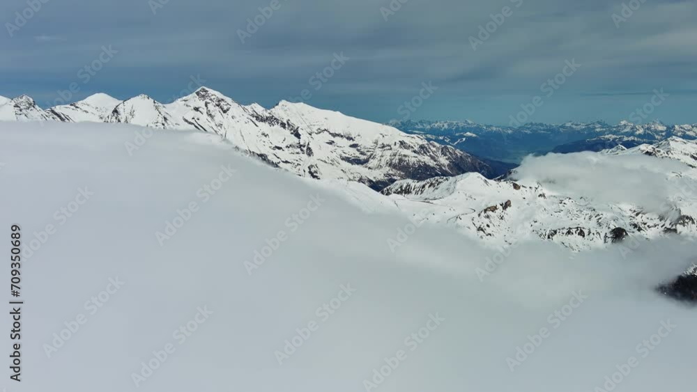 Aerial panorama view of snow mountain range landscape with moving clouds. Alps mountains, Austria, 4k Aerial panorama view of snow mountain range landscape with moving clouds. Alps mountains, Austria, 4k